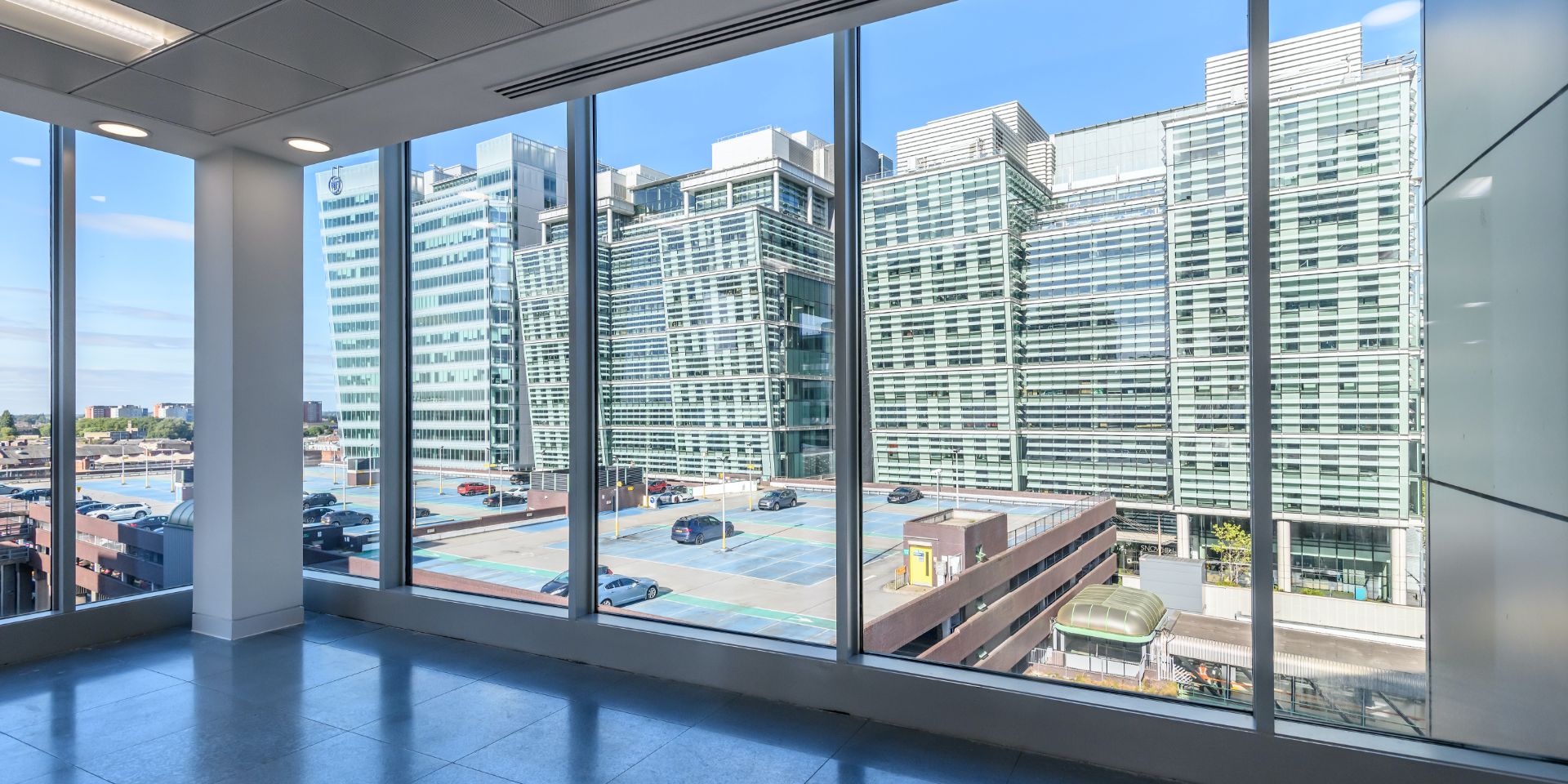 Floor to ceiling glass windows looking out over Snow Hill.